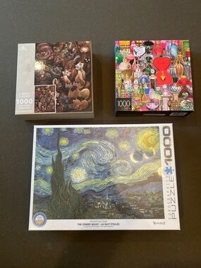 Lot of 3 - 1000 piece jigsaw puzzles. New in box.